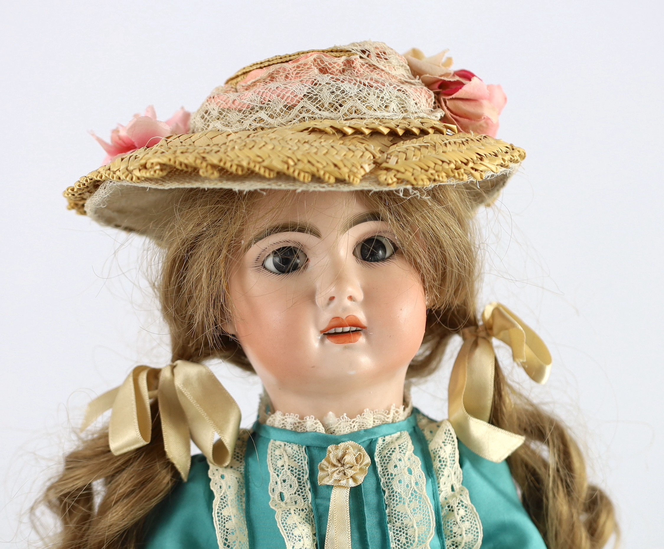 A bisque fashion doll, French, circa 1900, 20in.